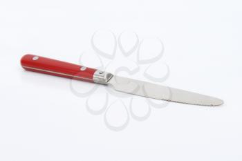table knife with red handle