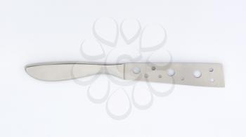 cheese knife with holes in the blade, designed for slicing soft cheese