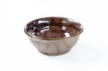 empty deep brown pottery bowl