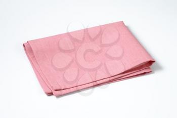 pink cloth napkin folded twice
