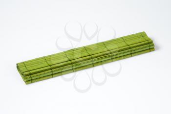 folded green bamboo place mat