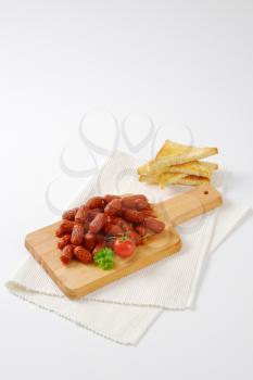 mini cabanossi sausages with toasted white bread