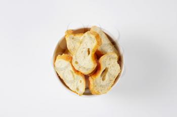 sliced French bread in white bowl