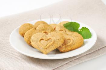 heart-shaped cookies on white plate