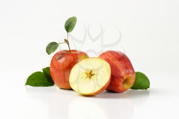 two red apples and half with a star-shaped core