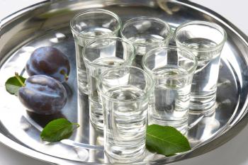 Shots of plum brandy (slivovitz) on metal serving tray