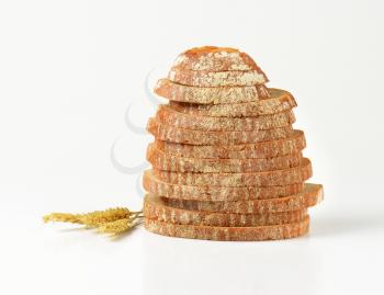 stack of sliced bread on white background