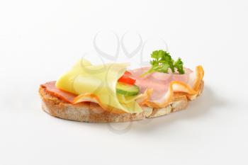 slice of bread with ham and cheese