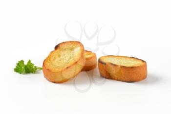 pan fried slices of French bread roll