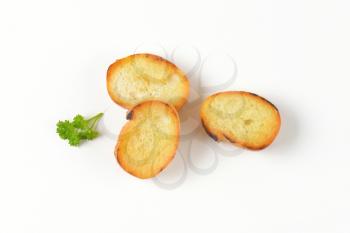 three pan fried French bread slices