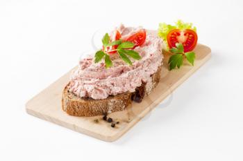 slice of bread with ham spread