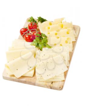 variety of sliced cheeses on cutting board