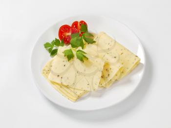 thin sliced cheese flavored with herbs