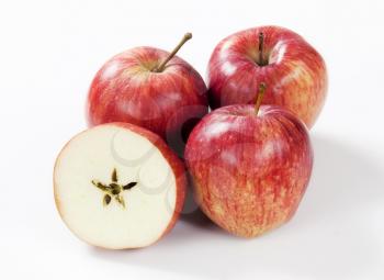 three red apples and half with a star-shaped core