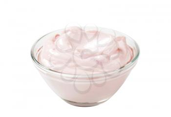 bowl of light pink yogurt isolated on white