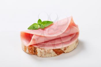 Slice of continental bread with ham