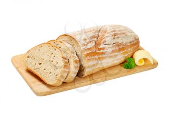 fresh sliced bread on a wooden cutting board