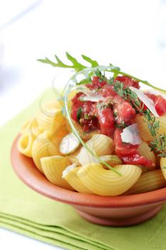 Bowl of pasta with crushed tomato and Parmesan