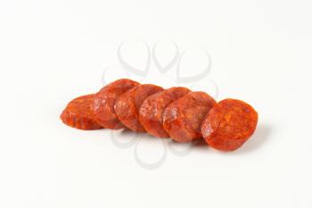Sliced spicy smoked Hungarian sausage (Csabai kolbasz)