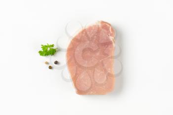 raw boneless pork loin chop on white background