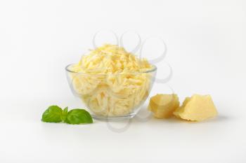 bowl of grated parmesan cheese