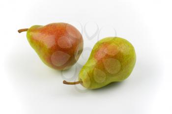 close up of two ripe pears on white background