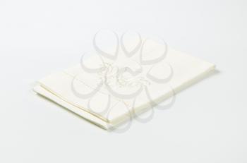 white cotton napkin with embroidered ornament