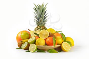 plate of fresh tropical fruit on white background