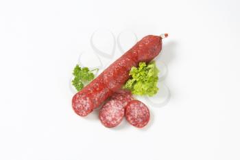 Smoked sausage salami on white background