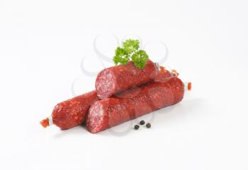 Smoked sausage salami on white background