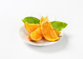 Sliced orange on white plate