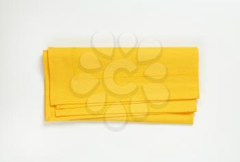 yellow cloth place mat on white background