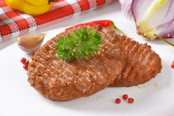 close up of pan fried hamburger patties