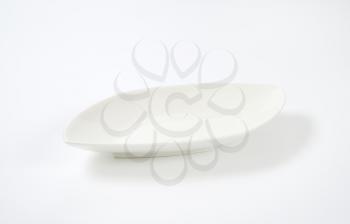 empty diamond shaped white dinner plate