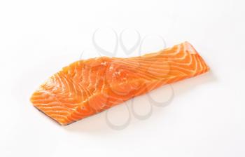 raw salmon fillet on white background