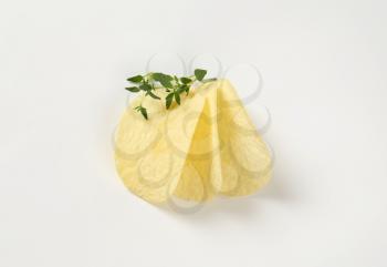 potato chips and thyme on white background
