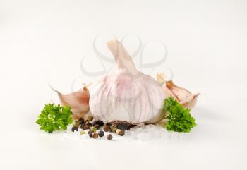 fresh garlic with spices on white background