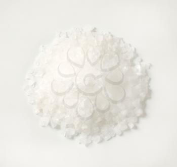 pile of coarse grained salt on white background