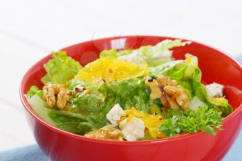 bowl of Chinese cabbage salad with orange, walnuts and blue cheese
