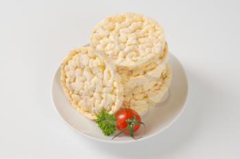 stack of puffed rice bread slices on white plate