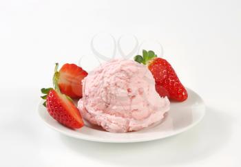 scoop of strawberry ice cream and fresh strawberries