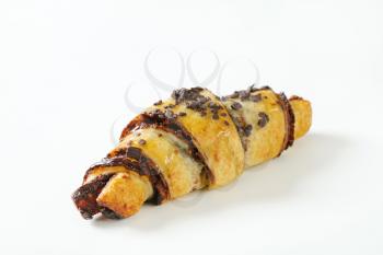 chocolate chip croissant on white background