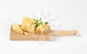 parmesan cheese and oregano on wooden grater