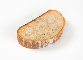 Thick slice of bread on a white background