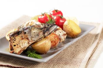 Pieces of crispy spiced mackerel with new potatoes