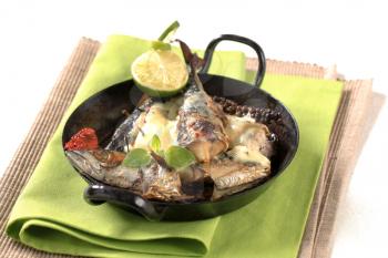 Pan fried mackerel topped with cheese