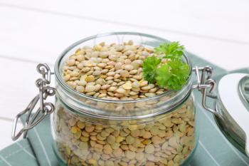 jar of dry brown lentils - close up