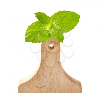 fresh mint leaves on wooden cutting board