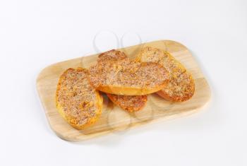 Crisp Melba toast with cinnamon on cutting board