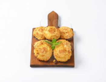 sweet coconut cookies on wooden cutting board